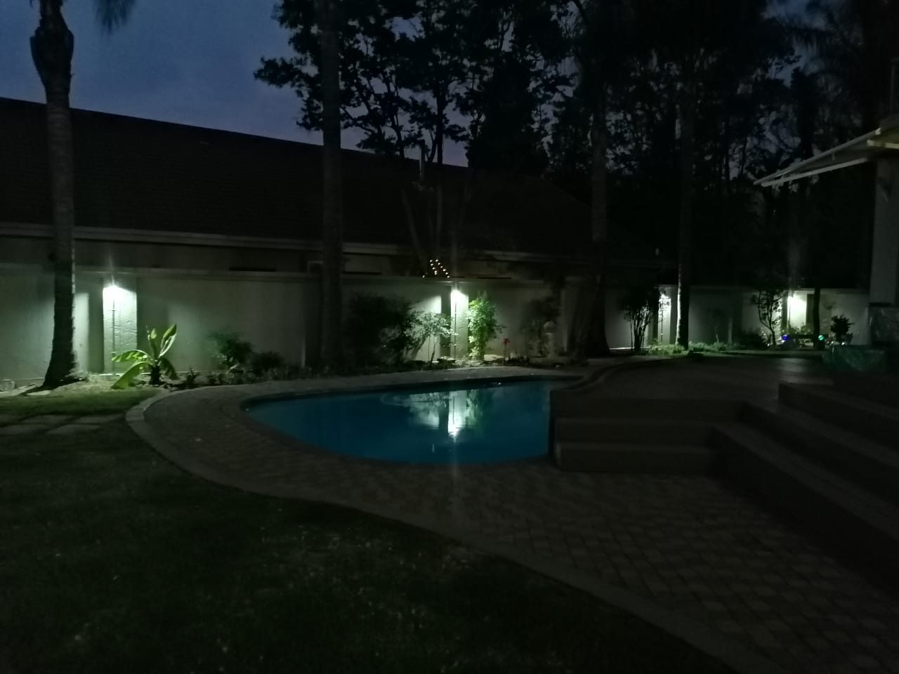 Garden perimeter lighting glowing at dusk