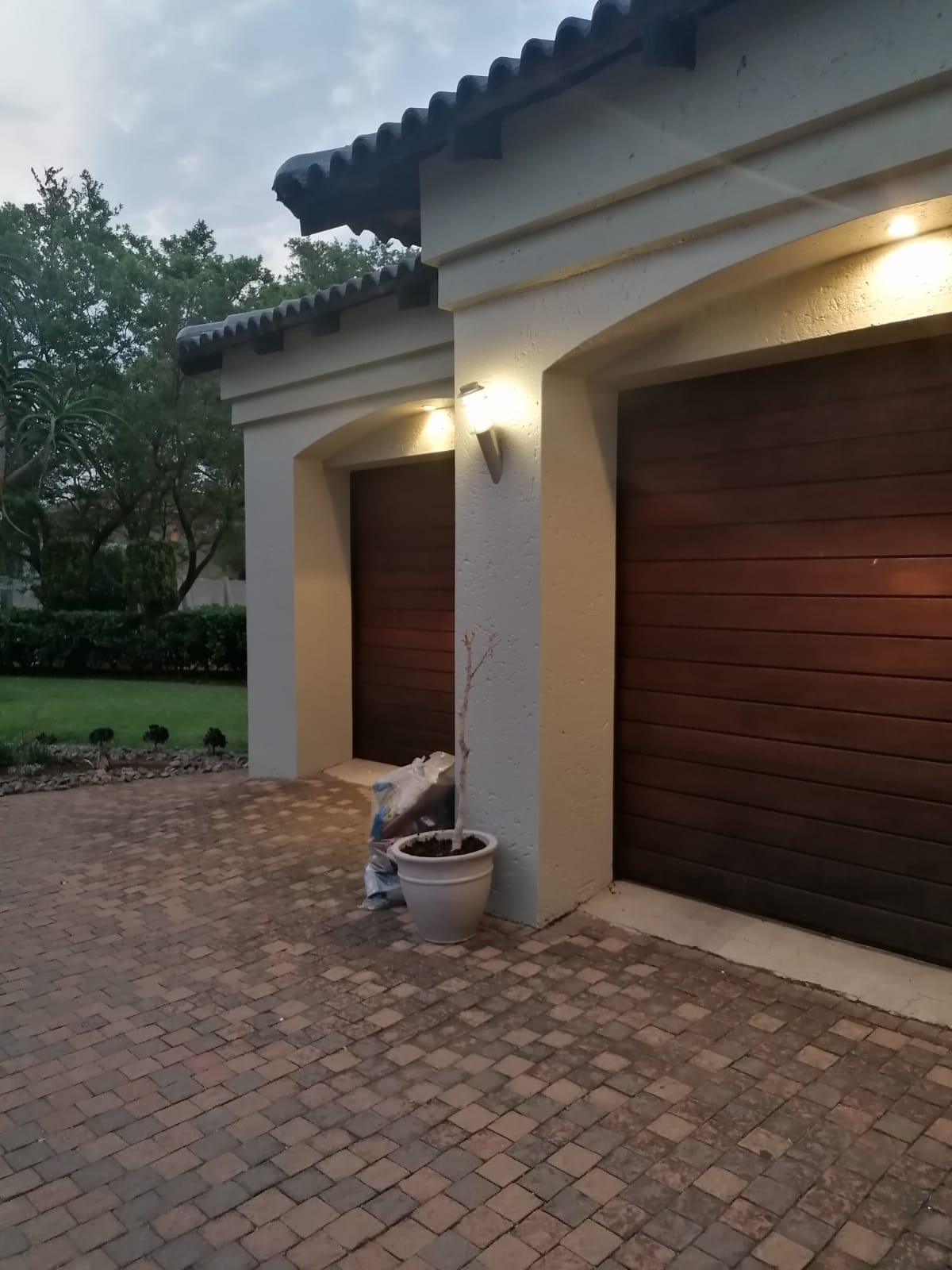 Security perimeter lights along a garden fence